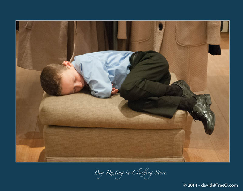Boy Resting in Clothing Store
