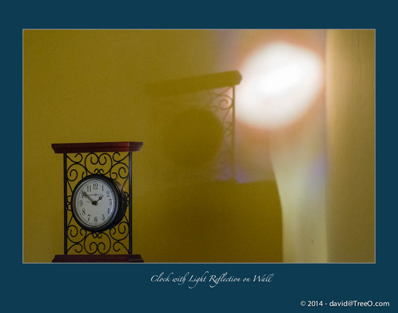 Clock with Light Reflection on Wall